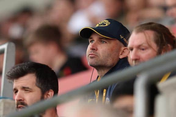 Rohan Smith, centre, watches on during Rhinos' defeat at Salford. Picture by John Clifton/SWpix.com.