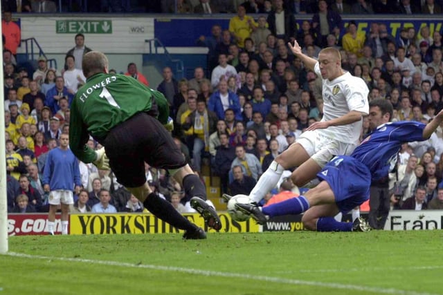 Striker Alan Smith scores his first goal of the game.