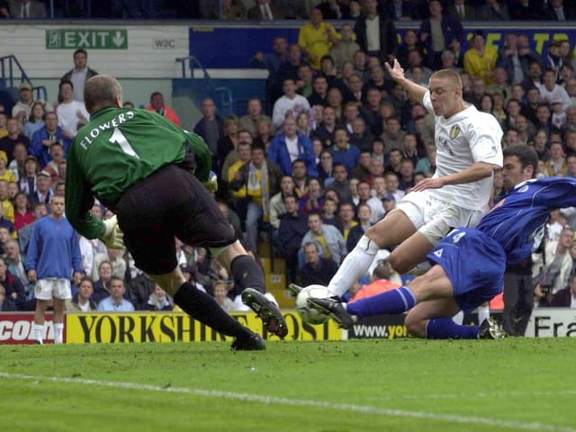 Striker Alan Smith scores his first goal of the game.