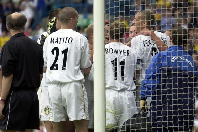 Leeds United celebrate after Alan Smith scored the opening goal.