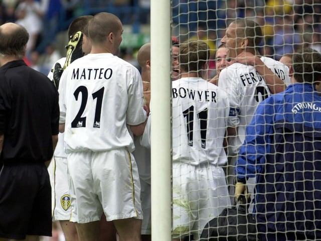 Leeds United celebrate after Alan Smith scored the opening goal.