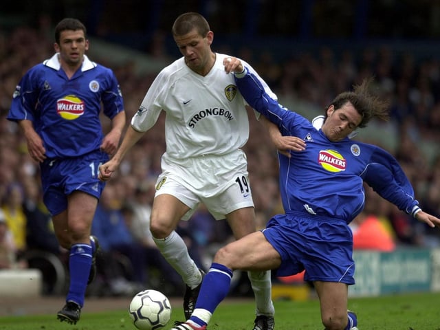 Eirik Bakke is tackled by Leicester City's Matthew Jones.