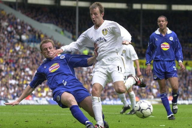 Lee Bowyer has his run checked by Leicester City's Gary Rowett.