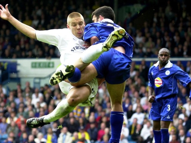 Alan Smith fires in a shot under pressure from Leicester City's Callum Davidson.