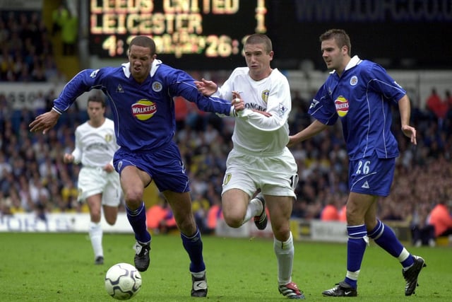 Harry Kewell chases down Leicester City's Junior Lewis.