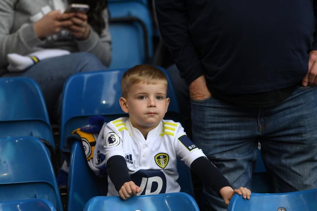 A young fan waits for kick-off.
