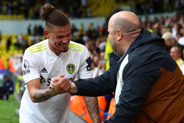 Kalvin Phillips greets the Leeds United support during the team's first home game of the 2021/22 campaign. Fans were unable to attend in number during the Whites' first season back in the top flight (Photo by Marc Atkins/Getty Images)