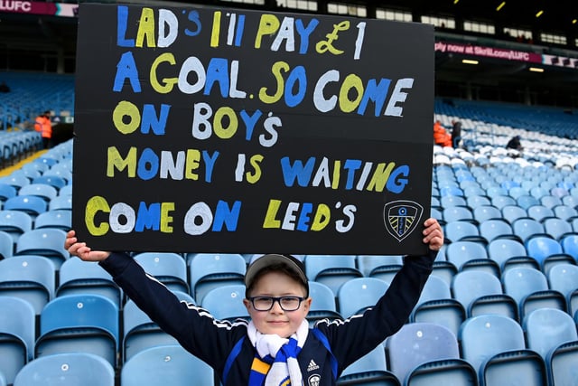 A young Leeds United supporter tries a novel motivational tactic to urge the team to find the back of the net (Photo by Michael Regan/Getty Images)