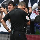 VAR: Referee Kevin Friend consults the pitchside monitor (Photo by GLYN KIRK/AFP via Getty Images)