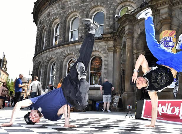HelloHipHop performers Scott Papworth and Phil Tang share their skills during the celebration outside Leeds Corn Exchange. Picture: Steve Riding