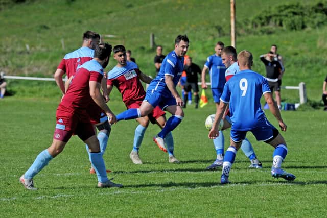 Matty Johnson, of Horbury Town, makes a nuisance of himself in the Rawdon defence. Picture: Steve Riding.