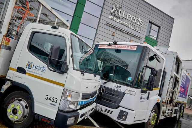 It must be love: two of Leeds City Council's bin lorries get aquainted at the new HQ.
