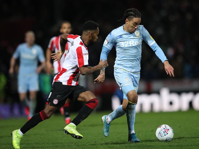 Helder Costa is hunted by Brentford's Rico Henry.