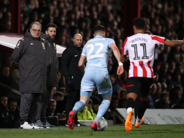 Marcelo Bielsa watches the action as Jack Harrison battles with Brentford's Ollie Watkins.