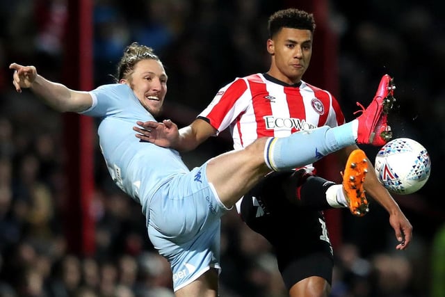 Luke Ayling reaches out for the ball ahead of Brentford's Oli Watkins.