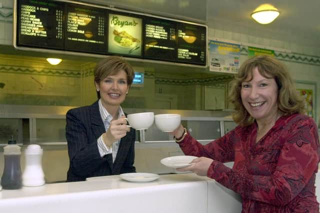 kay Mellor enjoys a coffee with Jan Fletcher, owner of Bryans Fish Restaurant as part of the 'World's Biggest Coffee Morning' in aid of Macmillan Nurses in September 2003. PIC: Gary Longbottom