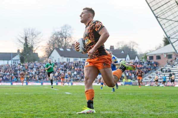 Tigers fans celebrate in the background as Greg Eden scores in the Cup win at Leeds. Picture by Allan McKenzie/SWpix.com.
