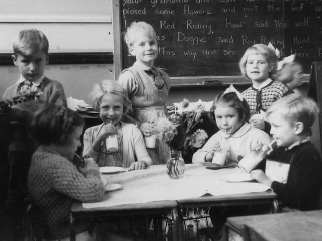 A group of children during their milk break. The Free School Milk Act of 1945 stipulated a quota of a third of a pint of milk a day for every child under the age of 18 years. From 1971 this changed to under seven years only,
