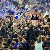 Huddersfield Town fans celebrate getting through to the play-off final. Picture: PA