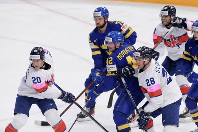 GB captain Jon Phillips, above left, said his team let themselves down with a poor first period against powerhouse Sweden. Picture: Dean Woolley/IHUK.