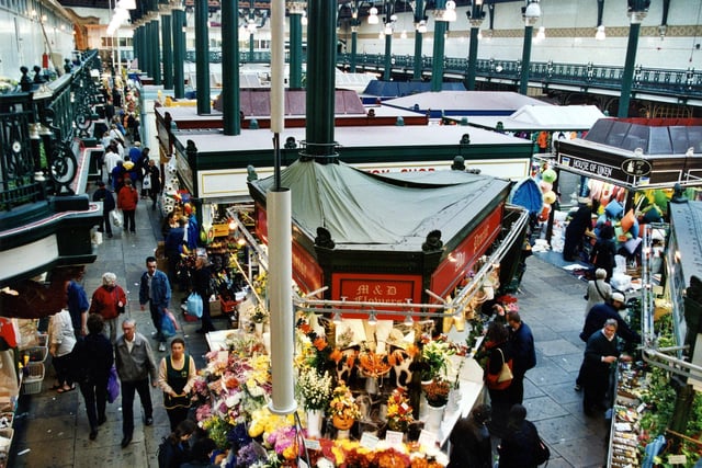 The stall in the centre of the photograph is Alan Proctor flower stall with The Toy Shop behind and House of Linen on the right.