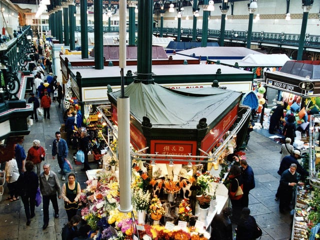 The stall in the centre of the photograph is Alan Proctor flower stall with The Toy Shop behind and House of Linen on the right.
