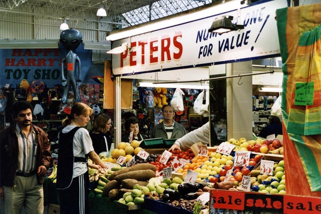 Peters' fruit and vegetable stall with produce on display. 'Happy Harry's' Toy stall can be seen on the left.