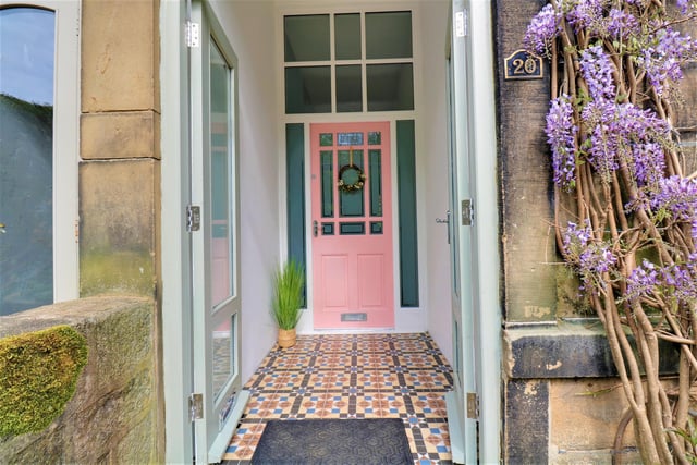 Double doors welcome you to the property, and in to a porch with decorative tiled floor.