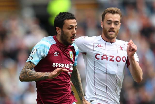 Burnley winger Dwight McNeil holds off the challenge of Calum Chambers during the Clarets' 3-1 defeat to Aston Villa. Pic: Alex Livesey.
