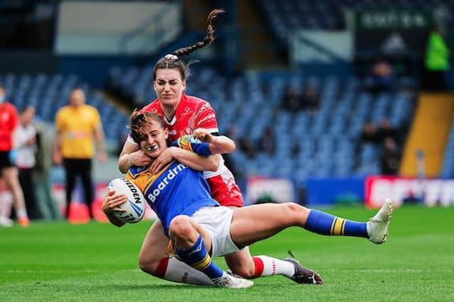 Rhinos' Fran Goldthorp is tackled by Leah Burke, of St Helens, in the Challenge Cup final at Elland Road. Picture by Allan McKenzie/SWpix.com.