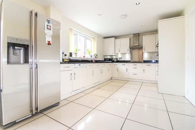 The kitchen is fitted with all modern appliances including an American fridge freezer.