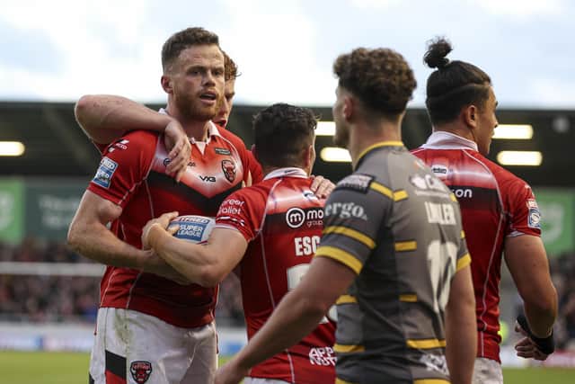 One better: Salford winger Joe Burgess bagged a hat-trick of touchdowns in the win over Tigers. Picture: Paul Currie/SWpix.com