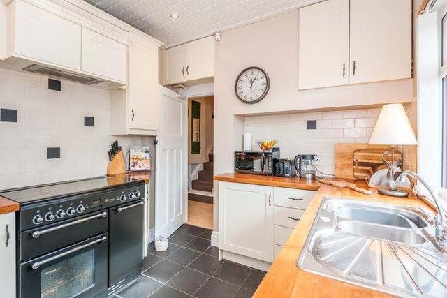 The kitchen is fitted with all modern appliances while keeping that traditional feel.