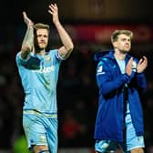BACK ON TRACK: Whites captain Liam Cooper, left, and striker Patrick Bamford, right, applaud Leeds United's travelling fans after the momentum-shifting 1-1 draw at Brentford of February 2020. Picture by Bruce Rollinson.