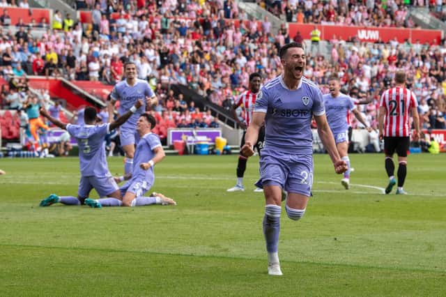 STAYING UP! Jack Harrison, right, made absolutely sure of Leeds United's Premier League survival when rifling home a 94th-minute rocket, above, to seal a 2-1 win at Brentford when one goal for the Bees or Burnley would have sent the Whites down. Picture by Tony Johnson.
