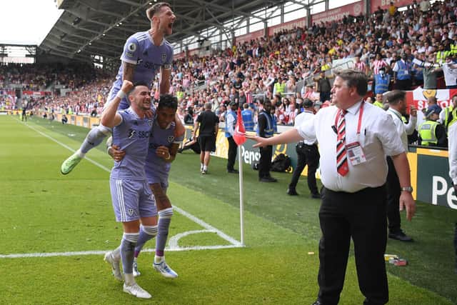 GREAT ESCAPE: Leeds United captain Liam Cooper, top, and Whites goal scorers Jack Harrison, left, and Raphinha, right, celebrate Harrison's late strike at Brentford which made absolutely sure of survival. Photo by Alex Davidson/Getty Images.