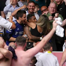 Leeds United man-of-the-match contender Raphinha celebrates survival in the stands with the friends and fans after the Premier League win at The Brentford Community Stadium. Picture: John Walton/PA Wire.