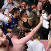 Leeds United man-of-the-match contender Raphinha celebrates survival in the stands with the friends and fans after the Premier League win at The Brentford Community Stadium. Picture: John Walton/PA Wire.