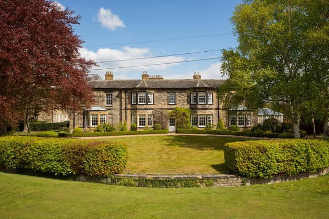 Lawned gardens with mature trees include a charming 'sun trap' walled garden with terraces.