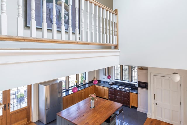 On the first floor the impressive landing has feature mullioned windows and gallery overlooking the living kitchen.