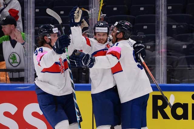 Robert Dowd (centre) celebrates his second period goal against Austria. Picture: Dean Woolley/IHUK.