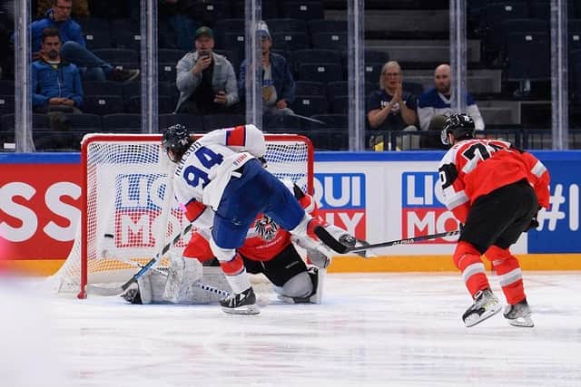 HOPE: Cade Neilson slots home past Bernhard Starkbaum to make it 3-1 to GB in the third period. Picture: Dean Woolley/IHUK.