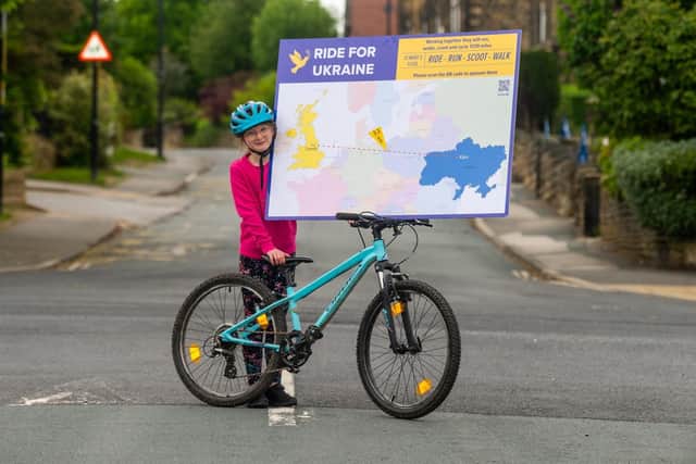 Picture James Hardisty....Elsie Ormiston, a pupil at St Margaret's Primary School, Horsforth, Leeds, has helped to organised a fundraising campaign for Ukraine - Along with her classmate they will be covering the distance from Leeds to Kyiv by various means running, cycling, Walking, and Scootering.