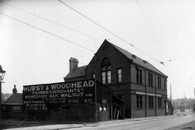 Hurst and Woodhead timber merchants on Great Wilson Street pictured in Febraury 1939.  The Society of Friends mission room is to the right.