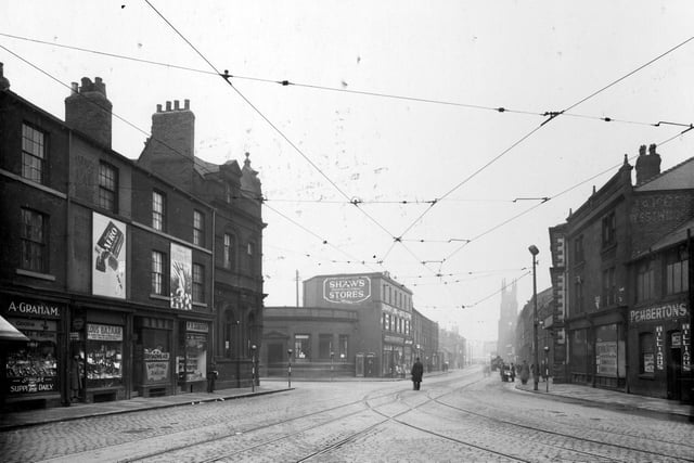 Meadow Lane in February 1937. On the left is Albert Graham greengrocer, then Lous' Bazaar, William Broadheade watch maker, P.H. Kaberry sweets and tobacco, a branch of Leeds Skyrac and then Morley Bank.