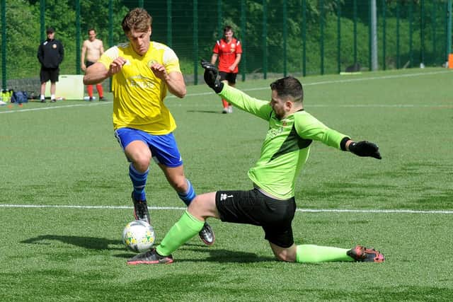 Michael Wood, of Horsforth St Margarets, is stopped by Knaresborough Town goalkeeper Liam Corbett. Picture: Steve Riding.
