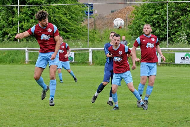 Littletown goalscorer Oliver Bellwood heads goalwards in the win over Calverley United. Picture: Steve Riding.