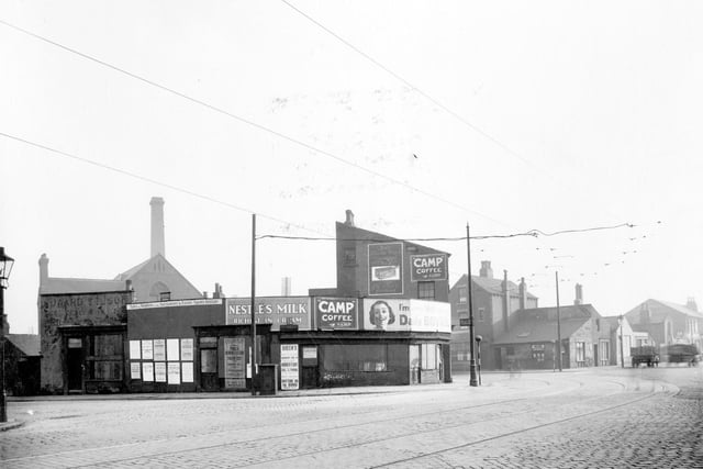 Neville Street is pictured in the foreground with tramlines in February 1939. On the right is Water Lane, with empty properties. The next junction is with Great Wilson Street and at the end a cafe run by Joseph Bray.
