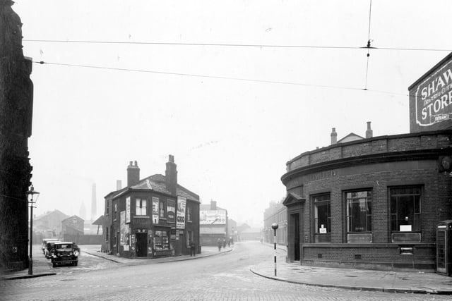 Victoria Road pictured in February 1937. Meadow Lane is to the right featuring a branch of Midland Bank.