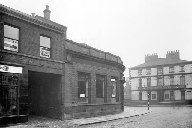 Pictured on the left of Victoria Road are the premises of P. Hansbro, cabinet maker. Entrance to Charles Court, then Midland Bank. On Meadow Lane is the Union Tavern public house.